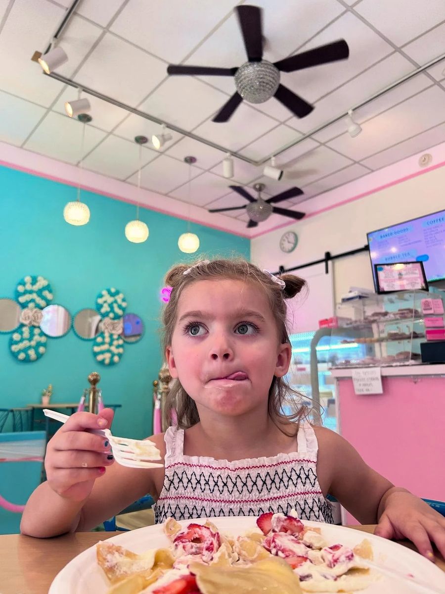 Enjoying crepes inside the shop